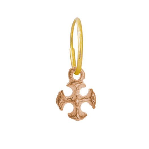 18k rose gold small textured lotus cross charm floats on a delicate Yellow Gold Endless Hoop Earring 